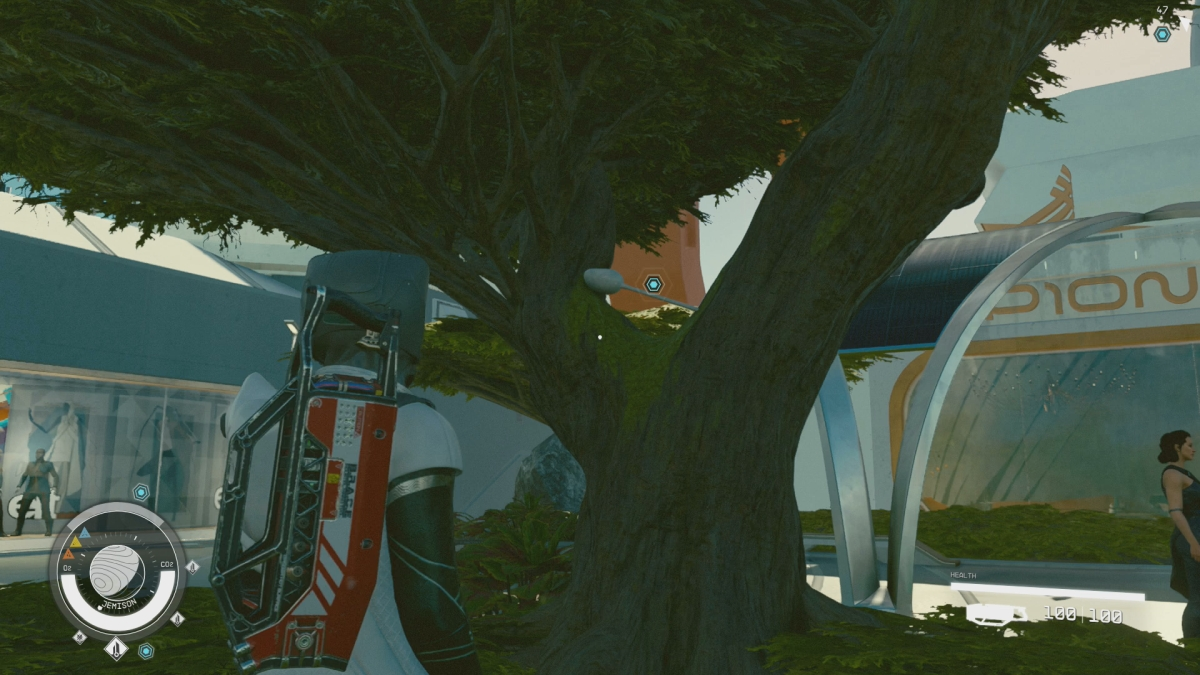 Starfield : Le scientifique près de l'arbre 2 Capteur Starfield reposant dans des branches d'arbres